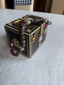 Elegant statement piece cigar box purse adorned with beautiful gems and jewelry